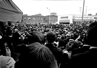 Crowd strains to hear speakers addressing the assassination of MLK